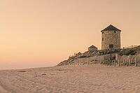 Old traditional wind-mills in sand-hills of Apulia Portugal [IBR124817872]