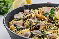 Traditional italian seafood pasta with clams Spaghetti alle Vongole [IBR124817879]