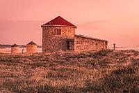 Old traditional wind-mills in sand-hills of Apulia Portugal [IBR124817889]