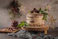 Delicious naked coffee and hazelnuts cake on table rustic wood kitchen countertop [IBR124817907]