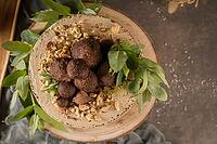 Delicious naked coffee and hazelnuts cake on table rustic wood kitchen countertop [IBR124817912]