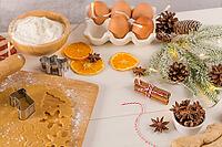 Raw dough for christmas cookies and cookie cutters on kitchen countertop [IBR124817931]