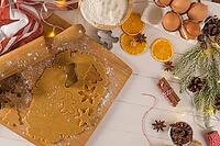 Raw dough for christmas cookies and cookie cutters on kitchen countertop [IBR124817933]