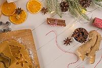 Raw dough for christmas cookies and cookie cutters on kitchen countertop [IBR124817936]