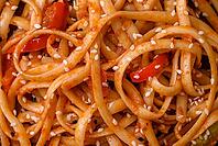 Food, Delicious asian udon dish with vegetables, mushrooms, salt and spices on a ceramic plate on a dark concrete background [IBR124842049]