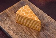 Food, Delicious fresh sweet honey cake layer cake with white cream on textured concrete background [IBR124842053]