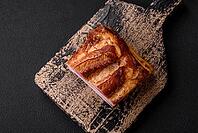 Food, Delicious calorie smoked bacon with salt, spices and herbs on a dark concrete background [IBR124842078]