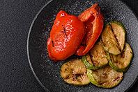 Grilled red bell peppers, vegetarian food. Red bell peppers as a food background for your design [IBR124865227]