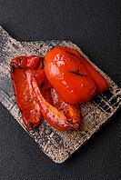 Grilled red bell peppers, vegetarian food. Red bell peppers as a food background for your design [IBR124865228]