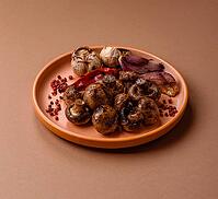 Grilled mushroom pieces, a vegetarian healthy meal with sauce. Barbecue mushroom halves as a food backdrop for your design [IBR124865229]