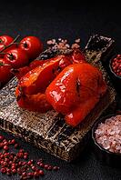 Grilled red bell peppers, vegetarian food. Red bell peppers as a food background for your design [IBR124865230]