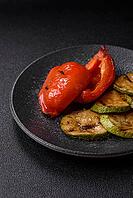 Grilled red bell peppers, vegetarian food. Red bell peppers as a food background for your design [IBR124865231]