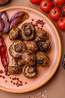 Grilled mushroom pieces, a vegetarian healthy meal with sauce. Barbecue mushroom halves as a food backdrop for your design [IBR124865232]