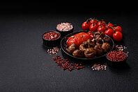 Grilled mushroom pieces, a vegetarian healthy meal with sauce. Barbecue mushroom halves as a food backdrop for your design [IBR124865235]