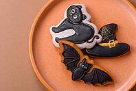 Halloween cookies, sweets, or gingerbread, a cat, a bat, and a hat. Halloween cookies as a backdrop for your design [IBR124865244]