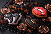 Halloween cookies, sweets, or gingerbread, a cat, a bat, and a hat. Halloween cookies as a backdrop for your design [IBR124865246]