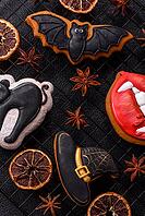 Halloween cookies, sweets, or gingerbread, a cat, a bat, and a hat. Halloween cookies as a backdrop for your design [IBR124865257]