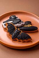 Halloween cookies, sweets, or gingerbread, a cat, a bat, and a hat. Halloween cookies as a backdrop for your design [IBR124865258]