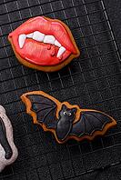 Halloween cookies, sweets, or gingerbread, a cat, a bat, and a hat. Halloween cookies as a backdrop for your design [IBR124865262]