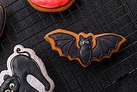Halloween cookies, sweets, or gingerbread, a cat, a bat, and a hat. Halloween cookies as a backdrop for your design [IBR124865264]