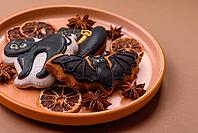 Halloween cookies, sweets, or gingerbread, a cat, a bat, and a hat. Halloween cookies as a backdrop for your design [IBR124865267]
