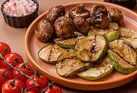 Grilled green zucchini slices, vegetarian food. Green barbecue zucchini as a food background for your design [IBR124865274]