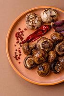 Grilled mushroom pieces, a vegetarian healthy meal with sauce. Barbecue mushroom halves as a food backdrop for your design [IBR124865276]
