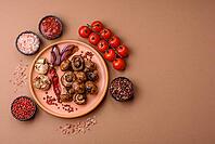 Grilled mushroom pieces, a vegetarian healthy meal with sauce. Barbecue mushroom halves as a food backdrop for your design [IBR124865280]