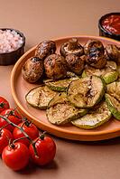 Grilled green zucchini slices, vegetarian food. Green barbecue zucchini as a food background for your design [IBR124865281]