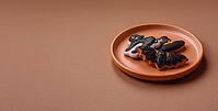 Halloween cookies, sweets, or gingerbread, a cat, a bat, and a hat. Halloween cookies as a backdrop for your design [IBR124865284]