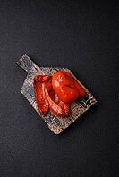 Grilled red bell peppers, vegetarian food. Red bell peppers as a food background for your design [IBR124865286]