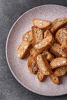 Italian cantuccini cookies with almonds, a sweet biscuit dessert. Cantuccini cookies as a food backdrop for your design [IBR124865289]