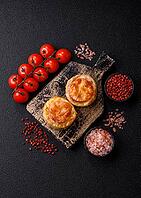 Round fish or chicken cutlets baked with tomato and cheese. Fish cutlets as a food backdrop for your design [IBR124865301]