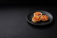 Round fish or chicken cutlets baked with tomato and cheese. Fish cutlets as a food backdrop for your design [IBR124865303]