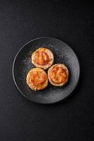 Round fish or chicken cutlets baked with tomato and cheese. Fish cutlets as a food backdrop for your design [IBR124865306]