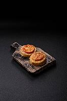 Round fish or chicken cutlets baked with tomato and cheese. Fish cutlets as a food backdrop for your design [IBR124865309]