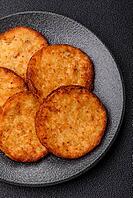 Potato hash browns, a cooked vegetable breakfast food. Potato hash browns as a food background for your design [IBR124865314]