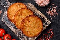 Potato hash browns, a cooked vegetable breakfast food. Potato hash browns as a food background for your design [IBR124865316]