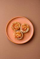 Round fish or chicken cutlets baked with tomato and cheese. Fish cutlets as a food backdrop for your design [IBR124865318]