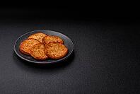 Potato hash browns, a cooked vegetable breakfast food. Potato hash browns as a food background for your design [IBR124865322]