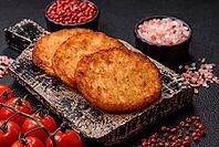 Potato hash browns, a cooked vegetable breakfast food. Potato hash browns as a food background for your design [IBR124865325]