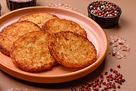 Potato hash browns, a cooked vegetable breakfast food. Potato hash browns as a food background for your design [IBR124865326]