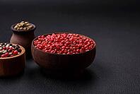 Food, Composition, concept, consisting of several types of different colors of allspice in bowls and spoons on a dark concrete background [IBR124876417]