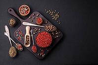 Food, Composition, concept, consisting of several types of different colors of allspice in bowls and spoons on a dark concrete background [IBR124876423]