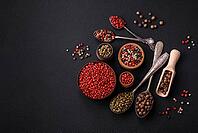 Food, Composition, concept, consisting of several types of different colors of allspice in bowls and spoons on a dark concrete background [IBR124876425]