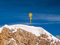 Summit cross on the Zugspitze, the highest mountain in Germany [IBR124898928]