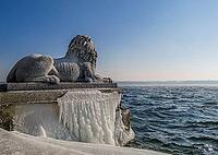Bavarian lion covered in ice on an icy winter day in Tutzing am Starnberger See, Upper Bavaria, Bavaria, Germany [IBR124898930]