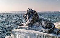 Bavarian lion covered in ice on an icy winter day in Tutzing am Starnberger See, Upper Bavaria, Bavaria, Germany [IBR124898948]