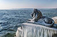 Bavarian lion covered in ice on an icy winter day in Tutzing am Starnberger See, Upper Bavaria, Bavaria, Germany [IBR124898953]