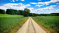 Rural economic trail between fields under a blue sky with clouds, hiking in spring, Waldnaabtal nature reserve, Upper Palatinate [IBR124899543]